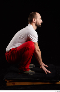 Orest  1 dressed grey shoes jogging suit kneeling red…